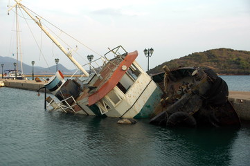 shipwreck in small harbour in greece