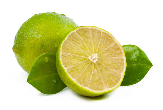 limes and slice with leaves isolated