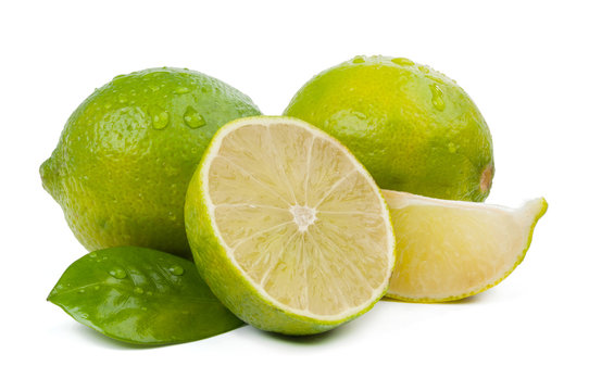 limes and slice with leaves isolated