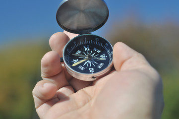 Compass in hand.