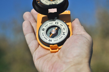 Compass in hand.