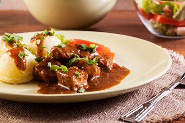 Goulash with boiled potatoes