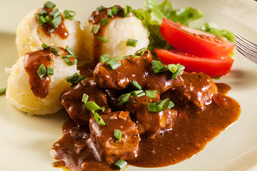 Goulash with boiled potatoes