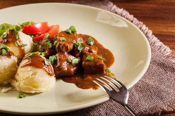 Goulash with boiled potatoes