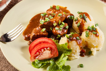 Goulash with boiled potatoes
