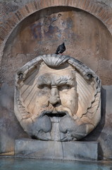 Mask Fountain at Santa Sabina in Rome