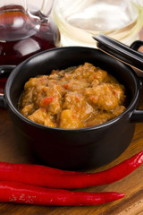 homemade hot goulash on wooden table