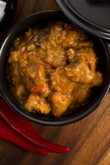 homemade hot goulash on wooden table