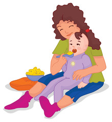 Big sister feeding a little baby brother or sister