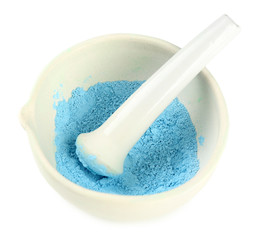 Laboratory pestle in mortar with ground material, isolated