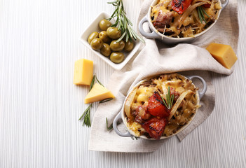 Pasta baked with vegetables and cheese in ceramic pot