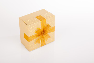 Golden gift box with golden bow