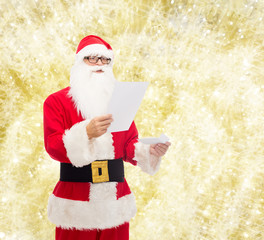 man in costume of santa claus with letter