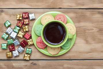 Gifts boxes with a colorful happy birthday cookie and tea cup