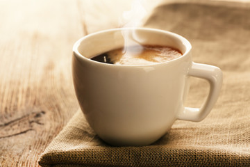 Cup of coffee on wooden table