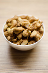 Roasted cashew nuts in white bowl