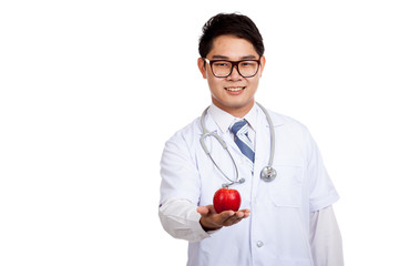 Asian male doctor smile with red apple