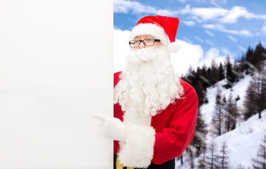 man in costume of santa claus with billboard
