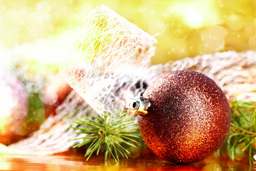 Golden christmas ball on abstract background