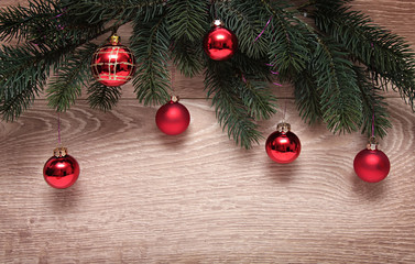 Fototapeta na wymiar Christmas fir tree with decoration on a wooden board