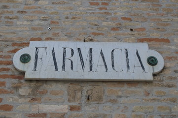 Farmacia, old pharmacy sign made of stone