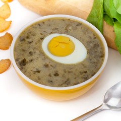Sorrel soup with egg and greens. Selective focus.