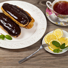 Eclairs with a chocolate ganache. Selective focus.