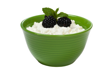 Cottage cheese with fresh blackberries. Selective focus.