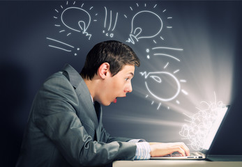 Emotional man using laptop