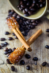 Sugar Stick Cinnamon and coffee bean on wooden table