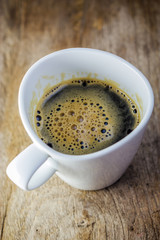 white cup. Cup Of Coffee on wooden table