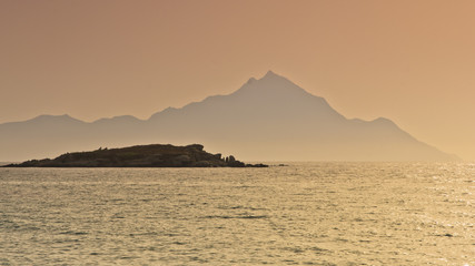Fototapeta na wymiar Sunrise at the beach near holy mountain Athos, Chalkidiki