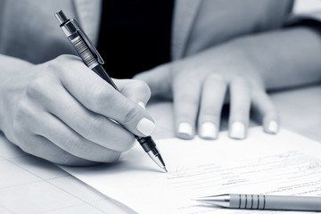 Business woman signing contract