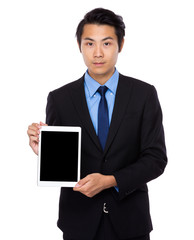 Businessman show the blank screen of tablet