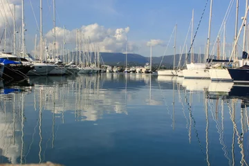 Fototapeten yacht and boat reflections in marina harbour © William Richardson