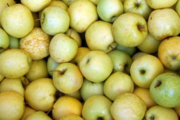 background of green apples on sale