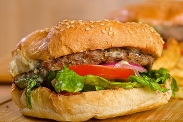 Tasty burger with melted cheese and thick succulent ground beef