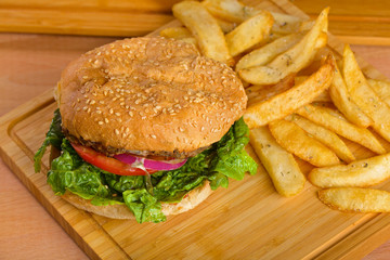 Tasty burger with melted cheese and thick succulent ground beef