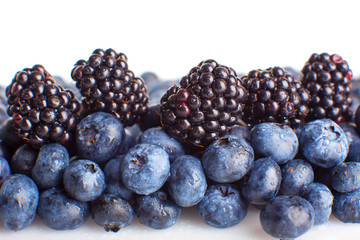 Freshly picked blueberries and blackberries close-up