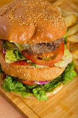 Tasty burgers with melted cheese and thick succulent ground beef