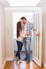 Cute couple walking through the door