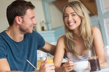 Cute couple having breakfast together