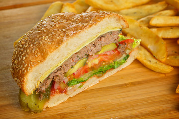 Cutted burger with melted cheese and thick succulent ground beef