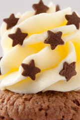 Chocolate stars on buttercream with cupcake