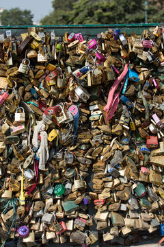 Paris - Pont de l'Archeveche covered with love padlocks.