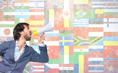 Man shouting over flags background