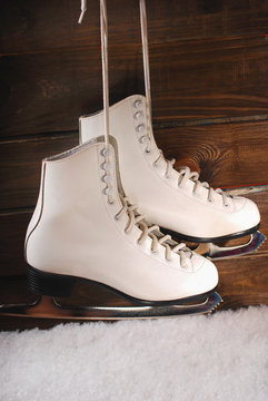 ice skates on wooden background
