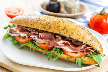 Prosciutto with rocket on sesame baguette