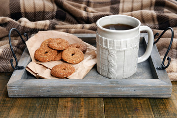 Cup of tea with cookies on table close-up