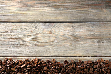 Coffee beans on wooden background